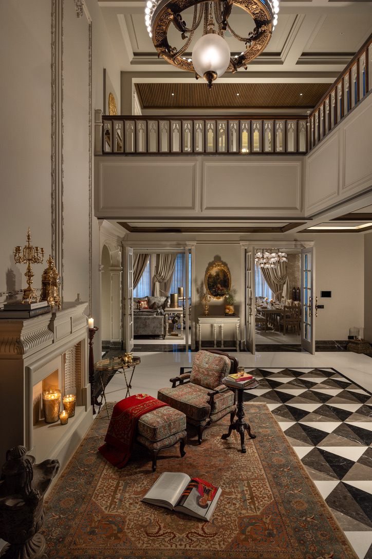 Double-height living room with gilded chandelier