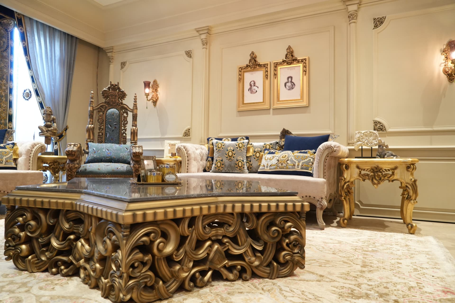 Gilded salon with carved baroque centre table and throne chair