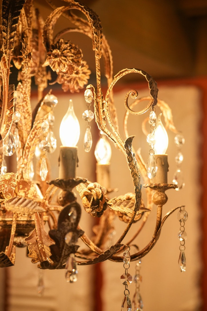 Close-up of a gilded iron chandelier frame